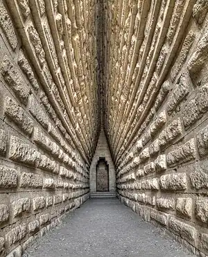 Image 11Royal KurganPhotograph: Anatoly ShcherbakThe Royal Kurgan is a 4th century BC kurgan (burial barrow) located near present-day Kerch, Crimea. The mound is almost 20 metres high and its base perimeter is about 250 metres. It holds a burial chamber with a square floor plan which gradually merges into the circular shape of a corbelled dome ("false vault"). It is assumed that the Royal Kurgan was the final resting place of a ruler of the Bosporan Kingdom.More selected pictures