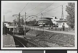 Motorcar leaves Smestad Station (postcard from 1930s)