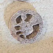 Seated figure drinking