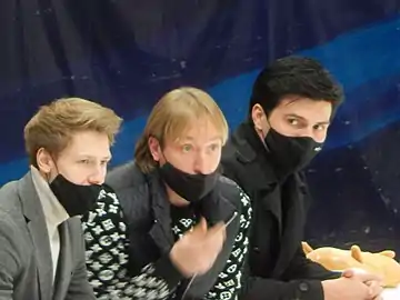 Coaches  Dmitri Mikhailov (left) and Evgeni Plushenko (center)