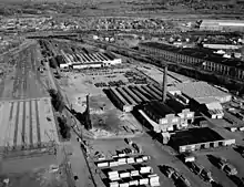 An aerial view of a disused railway yard with various buildings