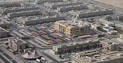 Aerial view of Umm Besher in 2014 with CentrePoint Mall in focus