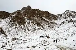 Afghan Local Police and other Afghan National Security Forces drive up a mountain pass in Omna district 2014.