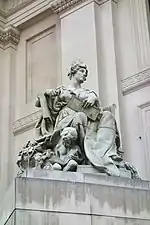 Stone statue of a seated woman
