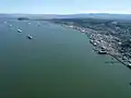 An aerial view of the Astoria waterfront and Tongue Point in the distance.