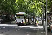 Cyclists and a tram on Swanston Street in Melbourne