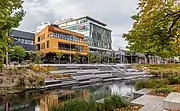 view of a river, a river terrace, and urban buildings
