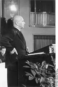 Kaiser standing at podium