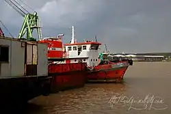 Ships are moored on the bank of Chao Phraya at Chong Nonsi