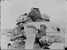 Lieutenant Giff Vivian (left) talks to Jack Griffiths while General Bernard Freyberg carries out reconnaissance (Libya, 1941; photo by White)