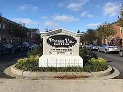 Entrance sign to Pleasant View Gardens Townhomes at Aisquith Street and New Hope Circle in Baltimore