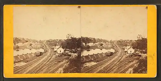 Falls of Schuylkill, from the western side of the river. Philadelphia and Reading Railway Bridge is at center. Laurel Hill Cemetery is visible at upper right.