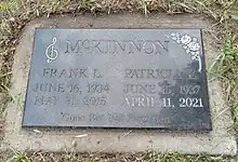 Flat black granite marker inscribed with names of McKinnon and his wife