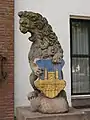 Town hall lion guardian with coat of arms