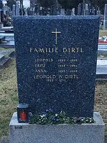 alt=A tombstone with a gold cross. The inscription reads:
Dirtl Family
Leopold 1890-1948
Fritz 1928-1956
Anna 1895-1969
Leopold W Dirtl 1922-2012