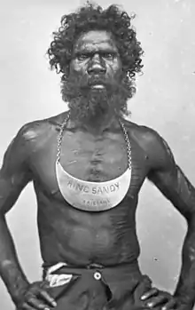 Aboriginal man wearing breastplate inscribed King Sandy Brisbane