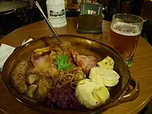 Image 33A "traditional Bohemian platter" at a restaurant in central Prague, consisting of roast duck, roast pork, beer sausage, smoked meat, red and white cabbage, bread, bacon and potato dumplings. (from Czech cuisine)