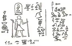 Drawing of a rock inscription showing a man standing and facing hieroglyphsStrudwick 2005, pp. 133–134.