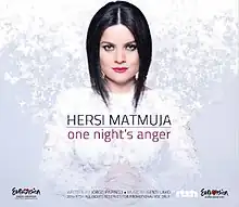 The image depicts a woman staring at the camera with her hands closed