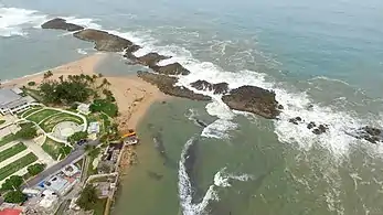 Aerial view of the beach and the natural limestone wavebreaks.