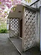 Pierced concrete block screen to the porch