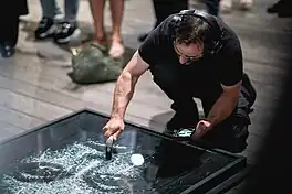 Simon Berger producing a new artwork in a live performance at Aurum Gallery, Bangkok