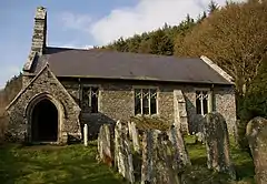 A single-storey church built in rubble stone with a bellcote and a porch at the Western end