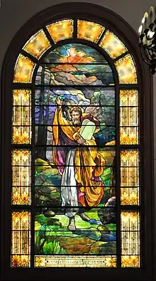 This stained glass window depicting Moses with the Tablets, now on the western side of the Schoenfeld-Gardner Chapel of Temple De Hirsch Sinai, Seattle, was salvaged from the 1908 Temple De Hirsch, where it was located on the east end, over the Ark and Torah. The text at the bottom says "In memory of Fred Schwabacher the gift of his mother".
