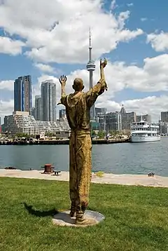 Migrants (bronze), 2007, Ireland Park, Toronto Harbourfront. The Jubilant Man stands 320 cm tall.