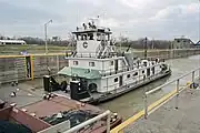 Towboat Enid Dibert departing main lock at McAlpine Locks, 1999