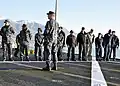 Capt. Karl O. Thomas, commanding officer of USS Mount Whitney, leads Sailors, civilian mariners, and embarked U.S. 6th fleet staff members to conduct a foreign object debris walk down on the flight deck prior to the ship getting underway for flight quarters on 1 February 2010. Mount Whitney is the U.S. Sixth Fleet's flagship. It is home-ported in Gaeta, Italy, and operates with a hybrid crew of U.S. Sailors and Military Sealift Command civilian mariners.