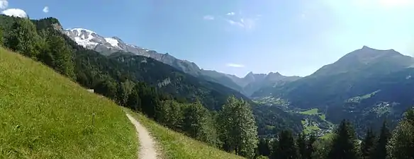 Summer view of the valley of Les Contamines ; left: the snow-capped Dômes, facing Mont-Joly.