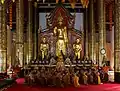 Monks chanting inside the viharn